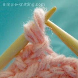 Bind off knitting tips, adjusting the last loopy bind off stitch
