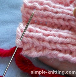 Weave in yarn tails in ribbing